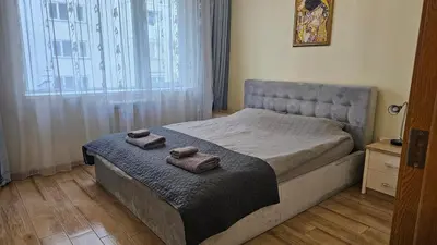 a bedroom with a bed with two towels on it at Little City Retreat in Sofia