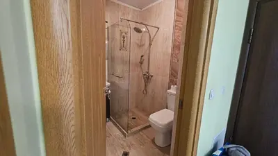 a bathroom with a shower and a toilet at Little City Retreat in Sofia