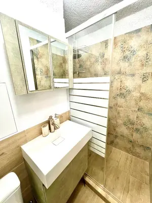 a bathroom with a sink and a shower at The Green Apartment 2BR - free parking in Sofia