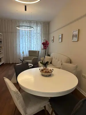 a white table and chairs in a living room at Sofo house in Sofia