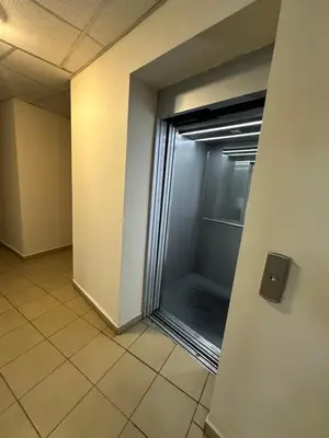 an empty hallway with a glass door in a building at Barbie Studio in Sofia