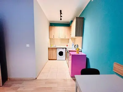 a kitchen with a pink refrigerator and a white dishwasher at Barbie Studio in Sofia