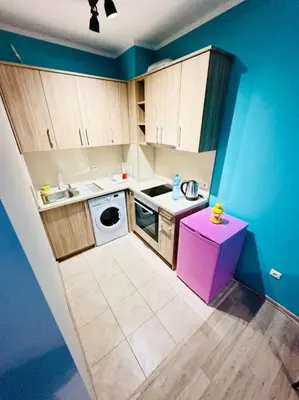 a small kitchen with a sink and a washing machine at Barbie Studio in Sofia