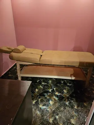 a couch sitting in a room with a table at Victori SPA in Dobrinishte