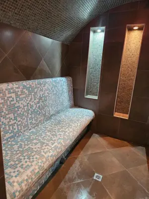 a bench sitting in a room with a window at Victori SPA in Dobrinishte