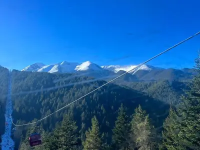 a gondola ride in the mountains with snow at Bansko Royal Towers Private Apartment V&K in Bansko