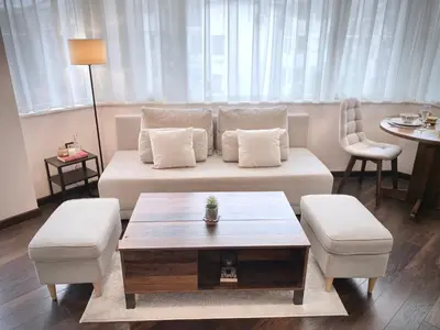 a living room with a couch and a table at Sunny & Cozy Apartment for 4 Guests & Free Parking in Plovdiv