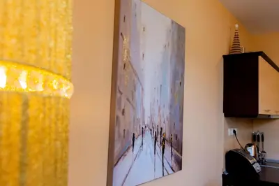 a painting hanging on a wall in a room at private apartment in a five-star hotel in Bansko in Bansko