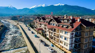 an aerial view of a city with mountains in the background at private apartment in a five-star hotel in Bansko in Bansko