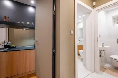 a bathroom with a toilet and a sink at Stunning Luxury 3 Bedroom Apt in the Heart of Town in Sofia