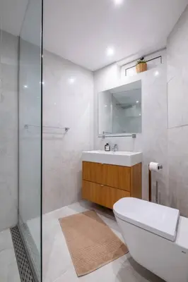 a bathroom with a toilet and a sink and a shower at Stunning Luxury 3 Bedroom Apt in the Heart of Town in Sofia
