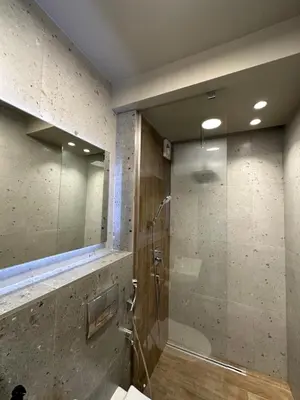 a bathroom with a shower with a glass door at Art apartment Pamporovo Grand Monastery in Pamporovo
