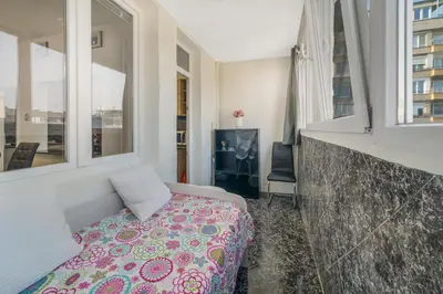 a bedroom with a bed and a window at Sunny Sofia Studio #1 in Sofia
