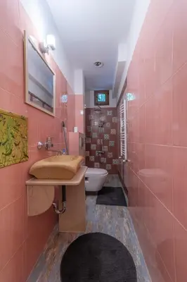a pink bathroom with a sink and a toilet at Top Center Relax, NDK & Vitoshka str, FREE Secured parking in Sofia