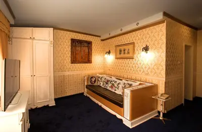 a room with a bed in the corner of a room at Hotel Boyana in Sofia