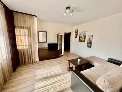 a living room with a couch and a table at Hani Guest House in Garmen