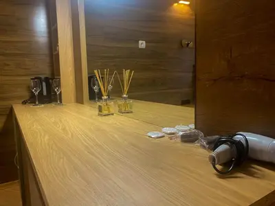 a table with wine glasses and trophies on it at Panorama View-Stoykite in Stoykite