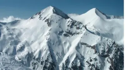 a mountain covered in snow with the top at Ski Lift Studio 531 in Bansko