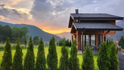 a house in the middle of a field with trees at HillVill in Govedartsi