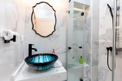 a bathroom with a sink and a shower at Sofia Royal Retreat in Sofia
