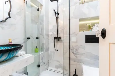 a bathroom with a shower and a sink at Sofia Royal Retreat in Sofia