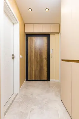 a hallway with a large door in a building at Duos of Delight Matching Urban Apartments for Your Plovdiv Adventure by Flat Mаnager in Plovdiv