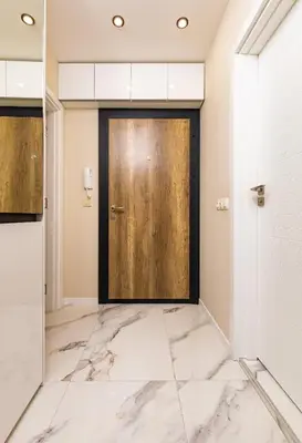 a lobby with a door and marble floors at Duos of Delight Matching Urban Apartments for Your Plovdiv Adventure by Flat Mаnager in Plovdiv