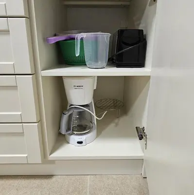 a coffee maker on a shelf in a kitchen at Four Seasons Apartment Bansko in Bansko
