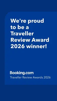 a blue sign that says were proud to be a traveller reviewagency winner at Trendy and stylish in city centre for business and leisure in Sofia