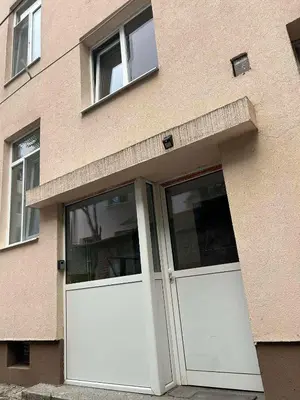 a building with two white doors and two windows at Apartament Sofia in Sofia