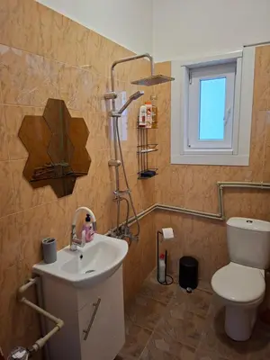 a bathroom with a toilet and a sink at Apartament Sofia in Sofia