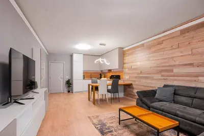 a living room with a couch and a table at Urban Elegance at Its Finest Stylish 1-BD Flat by Flat Mаnager in Sofia