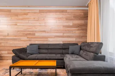 a living room with a couch and a table at Urban Elegance at Its Finest Stylish 1-BD Flat by Flat Mаnager in Sofia
