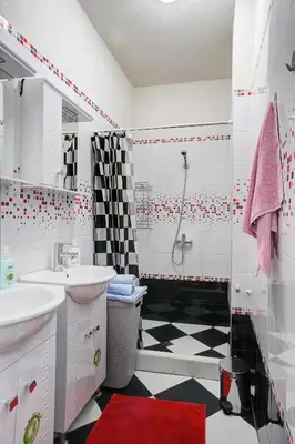 a bathroom with a black and white checkered floor at 10 Seconds Away from the Main street, Free Secured Parking in Sofia
