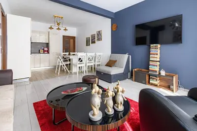 a living room with a couch and a table at 10 Seconds Away from the Main street, Free Secured Parking in Sofia