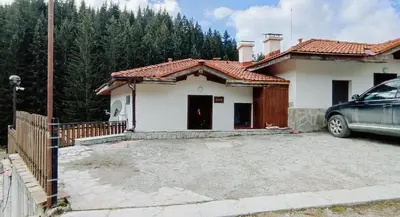 a house with a car parked in front of it at Mountain Pearls Home 8 in Vodata