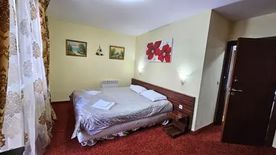 a small bedroom with a bed in a room at The Castle Mansarde on the slope 7 - Pamporovo in Pamporovo