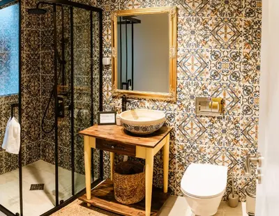 a bathroom with a sink and a toilet at Къща за гости РАДЕЯ in Govedartsi