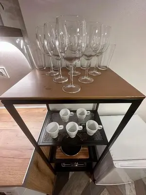 a group of wine glasses and bowls on a shelf at The rainbow 8 in Sofia