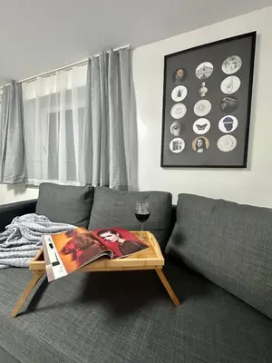a living room with a couch with a coffee table at The rainbow 8 in Sofia
