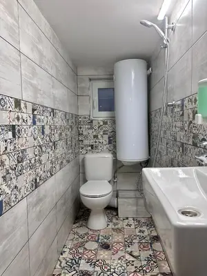 a bathroom with a toilet and a sink at The rainbow 8 in Sofia
