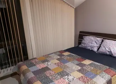 a bedroom with a bed with a quilt on it at Apartament by Zenit in Terra Complex Massonet D28 near Bansko in Razlog