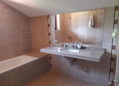 a bathroom with a sink and a bath tub and a sink at Apartament by Zenit in Terra Complex Massonet D28 near Bansko in Razlog