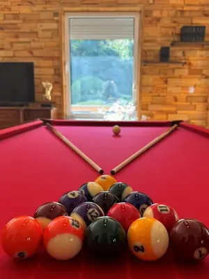a group of balls on top of a pool table at Villa Boyana City & Relax with Hot Jacuzzi and Sauna by BookVillaBG in Sofia