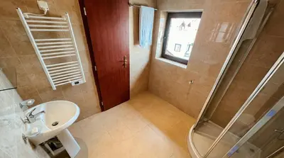 a bathroom with a shower and a sink at South Facing Bright Mountain View Penthouse - 2 balconies, 300mbps WIFI, washer in Bansko