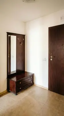 a room with a dresser and a mirror on the wall at Mountain Paradise 2 - Cosy Mountain View Apartment - 200mbps Wifi in Bansko