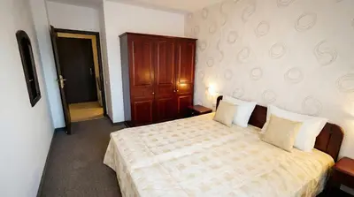 a bedroom with a bed and a door to a hallway at Mountain Paradise 2 - Cosy Mountain View Apartment - 200mbps Wifi in Bansko