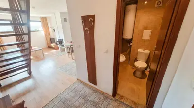 a bathroom with a toilet in a room at 1BR Bright 300mbps WIFI Duplex - Two Floors in Bansko