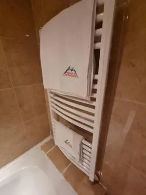 a white heater in a shower in a bathroom at 1BR Homey Duplex 300mbps WIFI - Two Floor with washer in Bansko