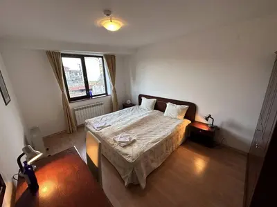 a bedroom with a bed and a window at 2BR Mountain View Apartment - Washer, 300mbps WIFI, Aircon in Bansko
